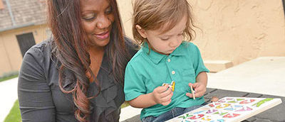 A hOpe staffer with a child