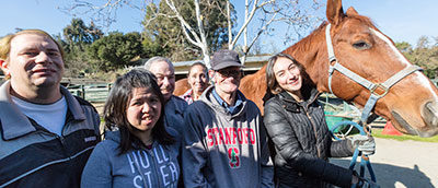 Hope clients and staffer with a horse
